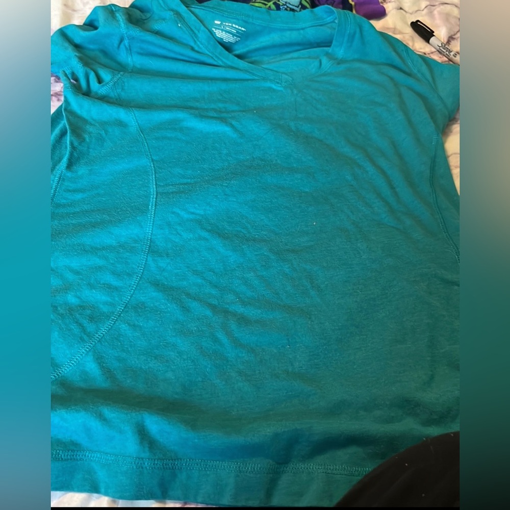 It’s a tekgear size large in blue , work out tee